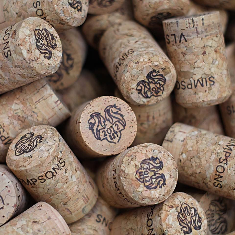 corks with 'simspons' and '2012 est' written on them